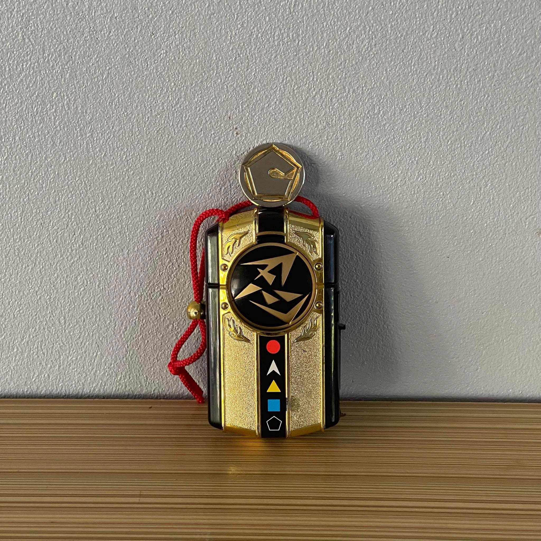 DX Doron Changer, the handheld transformation device from Ninja Sentai Kakuranger (1994), used by the Kakuranger team to morph and access ninja powers.