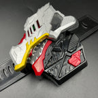 May include: A multi-colored toy with a dinosaur head design. The toy features a silver head with red and yellow accents, a black base, and red details. The design includes intricate patterns and textures, suggesting a mechanical or robotic theme.