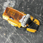 Kaizoku Sentai Gokaiger (2011) Striker Morpher, a collectible wrist morphing device, adapted as the Super Megaforce Morpher in Power Rangers (2012).