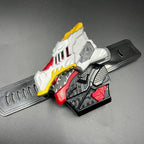 May include: A multi-colored toy with a dinosaur head design. The toy features a silver head with red and yellow accents, a black base, and red details. The design includes intricate patterns and textures, suggesting a mechanical or robotic theme.